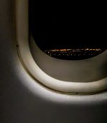 Night view of Auckland as plane descends to land at the airport