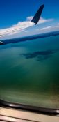 Beautiful view of ocean and clouds from a planes window