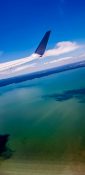 Beautiful view of ocean and clouds from a planes window