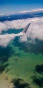 Beautiful view of ocean and clouds from a planes window