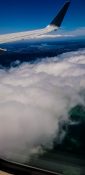 Beautiful view of ocean and clouds from a planes window