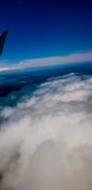 Beautiful view of ocean and clouds from a planes window