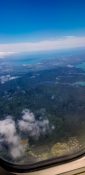 Beautiful view of ocean and clouds from a planes window