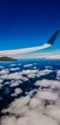 Beautiful view of ocean and clouds from a planes window