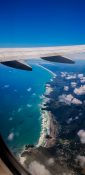 Beautiful view of ocean and clouds from a planes window