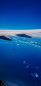 Beautiful view of ocean and clouds from a planes window