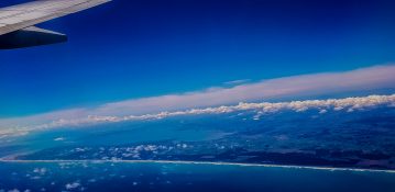 Beautiful view of ocean and clouds from a planes window