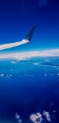 Beautiful view of ocean and clouds from a planes window