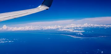 Beautiful view of ocean and clouds from a planes window