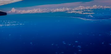 Beautiful view of ocean and clouds from a planes window