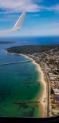 Beautiful view of ocean and coastal line from a planes window