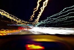 Uneven trail of lights created when taking long exposure shot from a moving vehicle