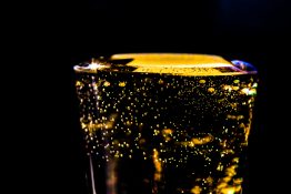 Bubbles formed in a glass after pouring fizzy drink in it