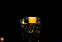 Bubbles formed in a glass after pouring fizzy drink in it