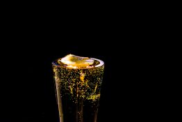 Bubbles formed in a glass after pouring fizzy drink in it