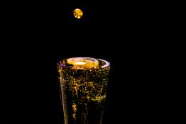 Bubbles formed in a glass after pouring fizzy drink in it