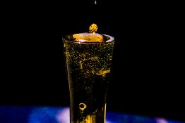 Bubbles formed in a glass after pouring fizzy drink in it