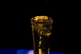 Bubbles formed in a glass after pouring fizzy drink in it