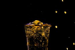 Bubbles formed in a glass after pouring fizzy drink in it