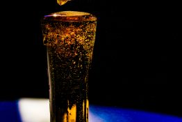 Bubbles formed in a glass after pouring fizzy drink in it