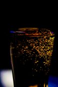 Bubbles formed in a glass after pouring fizzy drink in it