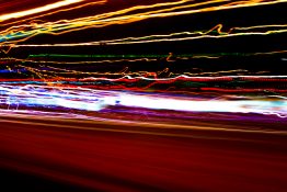 Long exposure shot of street lights from a moving car created a shaky line of streak of lights